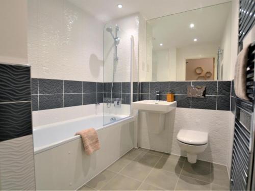 a bathroom with a toilet and a sink and a shower at 2 Bed in Bournemouth oc-48516 in Bournemouth
