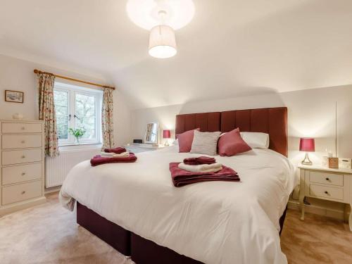 a bedroom with a large bed with two towels on it at 1 Bed in Chard oc-91135 in Cudworth