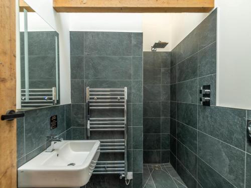a bathroom with a sink and a mirror at 4 Bed in Hexham oc-78159 in Catton