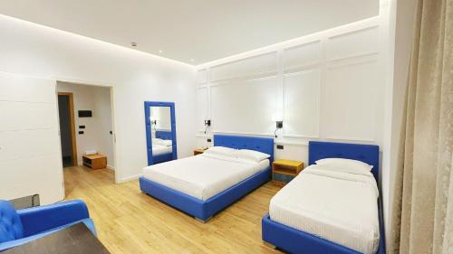 Llit o llits en una habitació de Aurelis Hotel