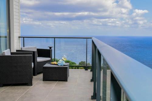 a balcony with a view of the ocean at GuestReady - Good Vibes in Ponta Delgada