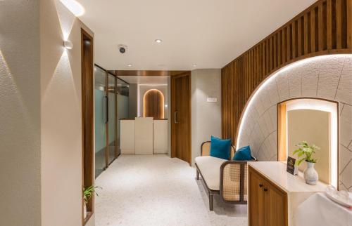 a hallway of a hotel room with a bathroom at Effotel By Sayaji Calangute, Goa in Calangute