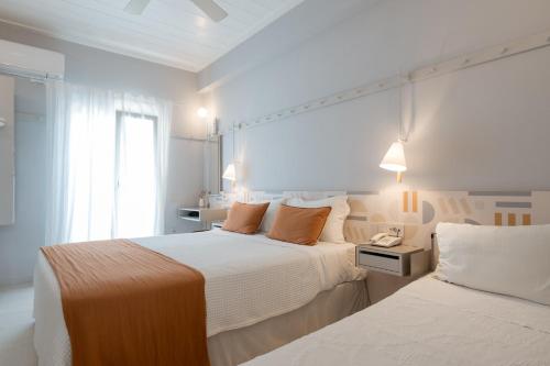 Voodi või voodid majutusasutuse Argonauta Hotel toas