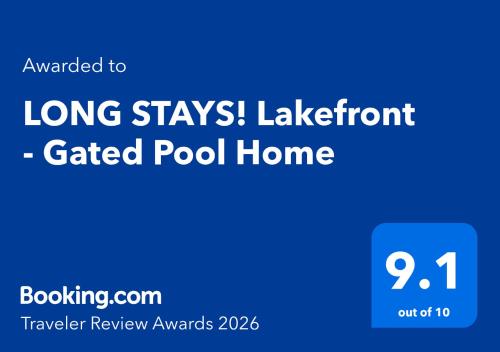 a blue sign with the words long stayslazelnut called pool home at LONG STAYS! Lakefront - Gated Pool Home in Orlando