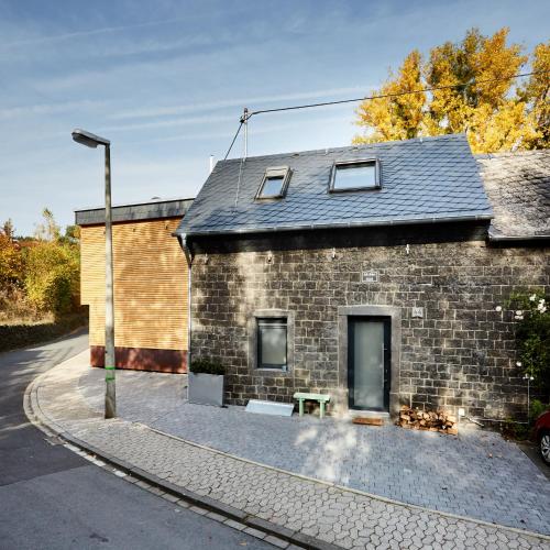 a brick building with a street light next to it at Basalt-Loft in Kottenheim