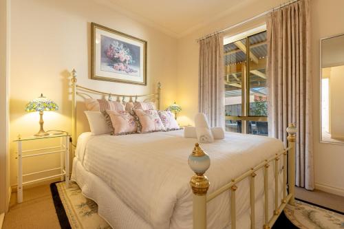 a bedroom with a large white bed and a window at Comfort & Quiet 3BR, CBD 5mins in Kennington