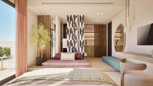 a bedroom with a bed and a balcony at Pefkos Beach Studios & Apartments in Pefki