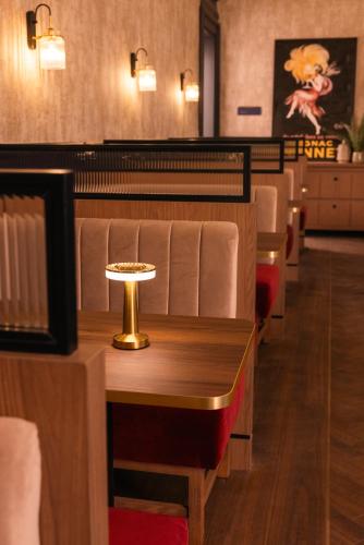 a dining room with a table and chairs at The Royal Bell in Bromley