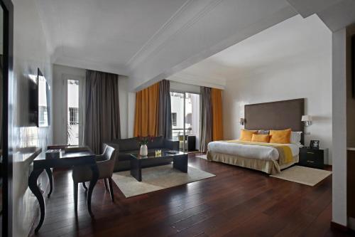 a hotel room with a bed and a desk at Park Suites Hotel Luxury Boutique Hotel in Casablanca