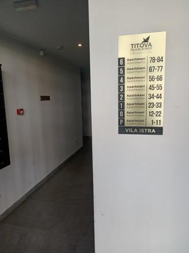 a sign on a column in a room with a wall at Aria lux Titova vila in Zlatibor