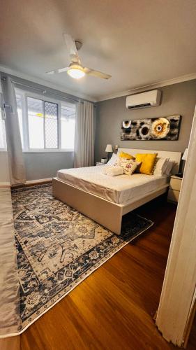 a bedroom with a large bed with a rug at Perth Airport 2 Bedroom duplex unit not apartment in Perth