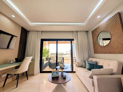 a living room with a couch and a table at Beautiful Apartment overlooking Samaná Bay in Cayo Vigía