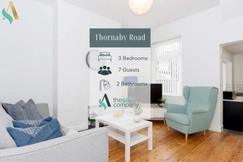 a living room with a couch and a chair at Thornaby Road TSAC in Stockton-on-Tees