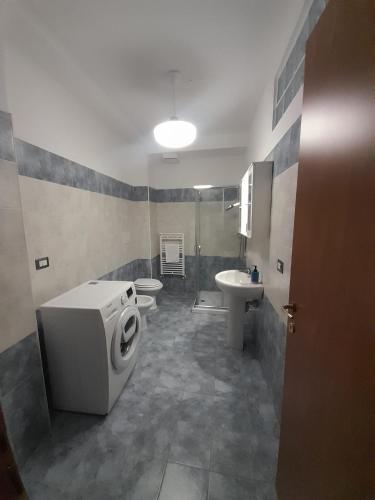a bathroom with a washing machine and a sink at Casa Molines in Giaveno