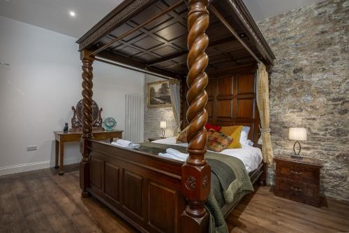 a bedroom with a four poster bed in a room at Luxury Barbican Apartment in Plymouth