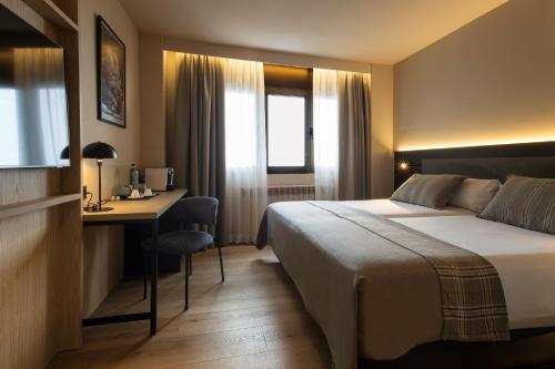 Llit o llits en una habitació de Hotel Màgic Pas by Nexta