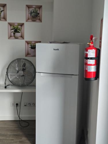 a fire hydrant is sitting on top of a refrigerator at Apartment in Semeador 1 in Portalegre