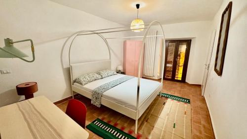a bedroom with a bed with a glass canopy at Pink House - InBorgo in Acquasparta
