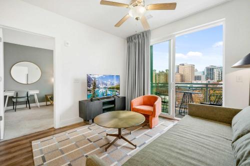 a living room with a couch and a table at Modern 1B1B Apartment with Private Balcony - 7 in Atlanta