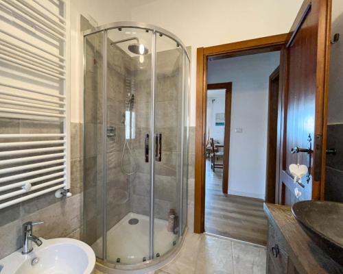 a bathroom with a shower and a sink at Home Nature and Relax in Monte del Lago