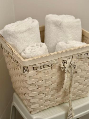 a basket of towels sitting on top of a table at HappyLivingApartments in Villach