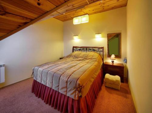a bedroom with a large bed in a room at Едем in Skhidnitsa