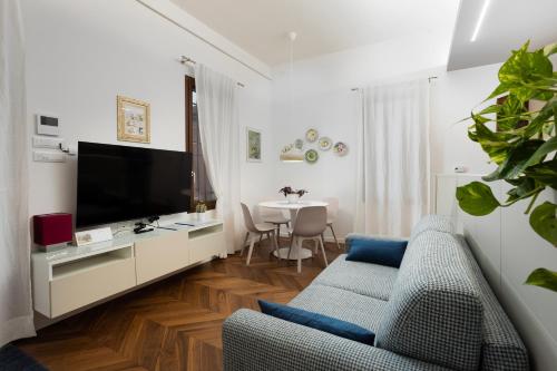 a living room with a couch and a tv at La Casa sui Colli in Bologna