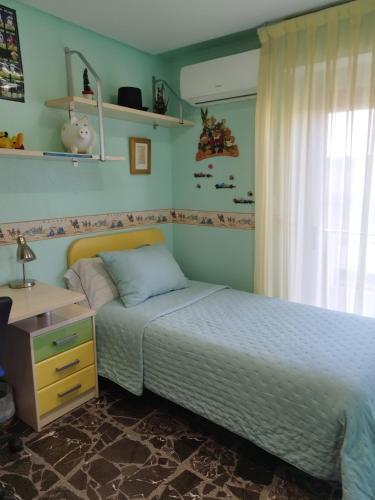 a bedroom with a bed and a desk at Elche Holidays in Elche