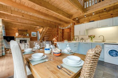 a kitchen and dining room with a table and chairs at 3 Bed in Wadebridge oc-p34722 in Little Petherick
