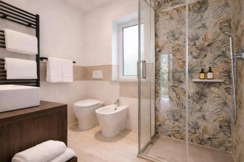 a bathroom with a shower and a toilet at Hotel Del Borgo in Sestri Levante