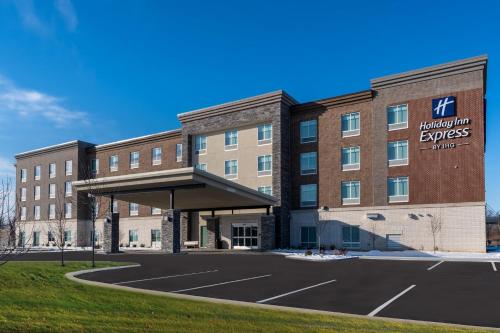 a building with a parking lot in front of it at Holiday Inn Express & Suites Westfield - Indianapolis by IHG in Westfield