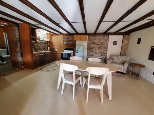 a kitchen with a table and chairs in a room at Tucson Mountain Guest Ranch in Tucson