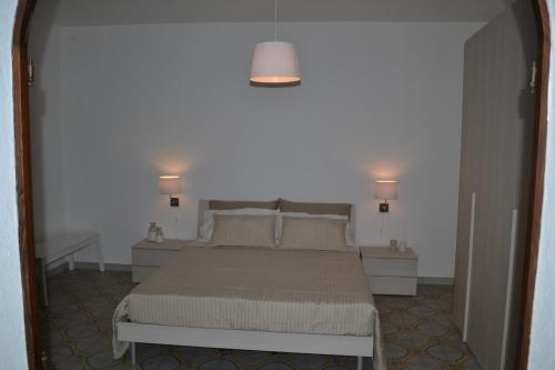 A bed or beds in a room at Charming Place Taormina