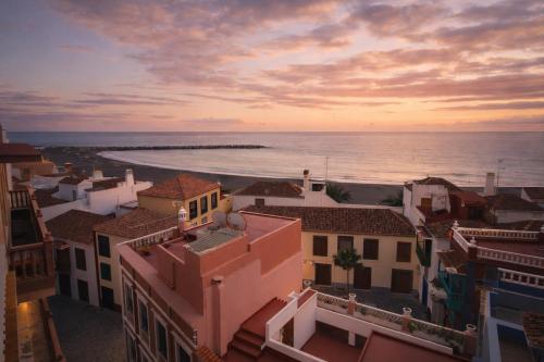 a view of the ocean from the roofs of buildings at Banana Garden La Palma in Santa Cruz de la Palma