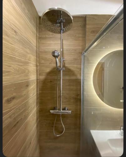 a shower in a bathroom with a sink and a mirror at Casa Carlitos Las Terrazas de La Torre Golf Resort in Murcia