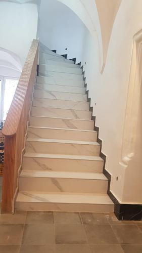 a staircase in a building with a stair case at Apartmán Tonny in Jáchymov