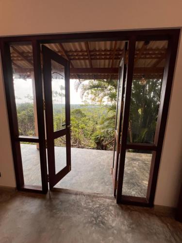 an open door to a room with a view at The Ellen Horizon in Baddegama