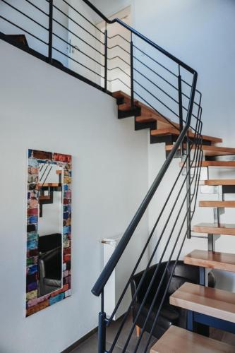 a staircase in a house with a mirror on the wall at FeWo Kibo Kupferberg in Kirchheimbolanden