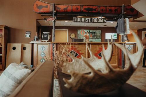 a room with a table with antlers on it at Wildwood Lodge in Pewaukee