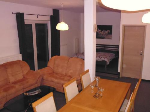 a living room with a couch and a table at B&B V.K. PGmbH in Saint-Vith