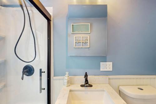 a bathroom with a sink and a toilet at 2 Mi to Beach! Hot Tub Haven in Michigan City in Pottawattamie Park