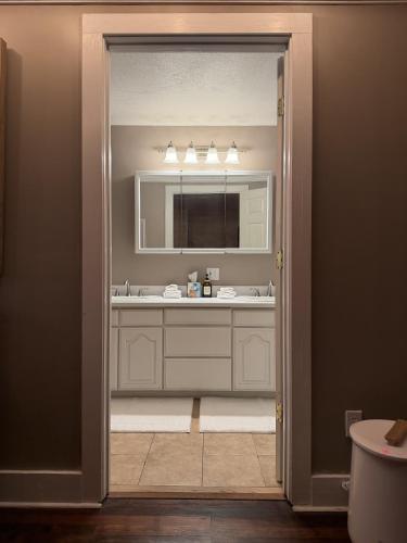 a bathroom with a sink and a mirror at Inn at Harbour Village in Ilwaco
