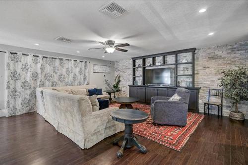 a living room with a couch and a tv at Villa Manteago in Bradenton