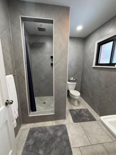 a bathroom with a shower and a toilet at Skyline Inn in Mount Pocono