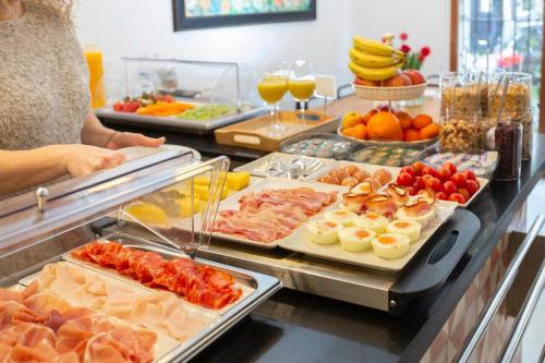a buffet line with many different types of food at Zalamera BnB in Valencia