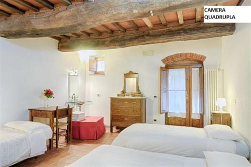 Ένα ή περισσότερα κρεβάτια σε δωμάτιο στο Casa Podere San Firenze