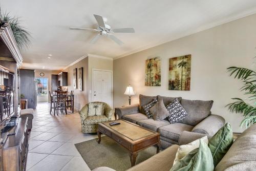 a living room with a couch and a table at Dawn 824-Sea n Swim in Galveston