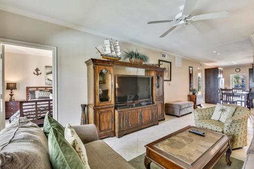 a living room with a tv and a couch at Dawn 824-Sea n Swim in Galveston