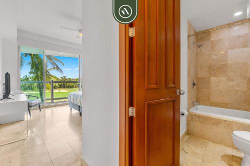 a bathroom with a toilet and a sink and a tub at New 2BR/2BA Nuevo Vallarta Condo | Pool, Beach in Nuevo Vallarta