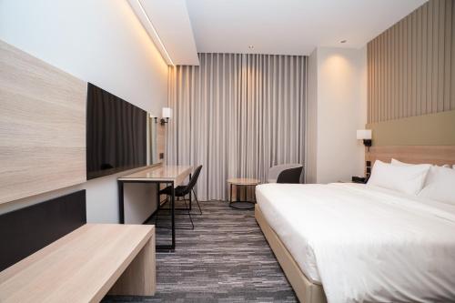 a hotel room with a bed and a desk at Azha Alriyadh in Riyadh